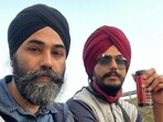 In the picture, it appears that Amritpal Singh and Papalpreet Singh are sitting atop a truck. 