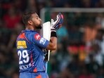 Bengaluru: Lucknow Super Giants batter Nicholas Pooran celebrates after scoring a half-century during the IPL 2023 cricket match between Royal Challengers Bangalore and Lucknow Super Giants, at M Chinnaswamy Stadium in Bengaluru, Monday, April 10, 2023. (PTI Photo/Shailendra Bhojak)(PTI04_10_2023_000253B)