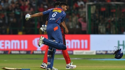 Lucknow Super Giants' Avesh Khan celebrates after winning the Indian Premier League (IPL) Twenty20 cricket match between Royal Challengers Bangalore and Lucknow Super Giants at the M Chinnaswamy Stadium in Bengaluru on April 10, 2023. (Photo by Manjunath KIRAN / AFP) (AFP)