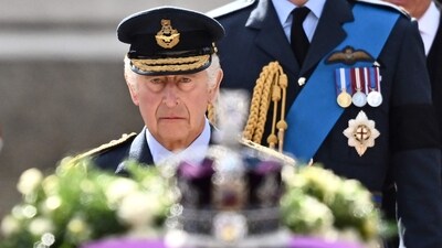 Britain's King Charles III walks behind the coffin of Queen Elizabeth II during a procession from Buckingham Palace to the Palace of Westminster, in London on September 14. (AFP) Britain's King Charles III walks behind the coffin of Queen Elizabeth II during a procession from Buckingham Palace to the Palace of Westminster, in London on September 14. (AFP)