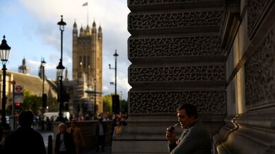 UK's ‘Quit Smoking’ Plan: A man vapes outside the Houses of Parliament, in London, Britain. (Reuters)