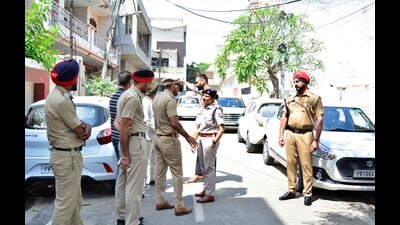 Police officials at the crime spot at Jawahar Nagar Camp in Ludhiana on Tuesday. (Manish Kalia/HT Photo)
