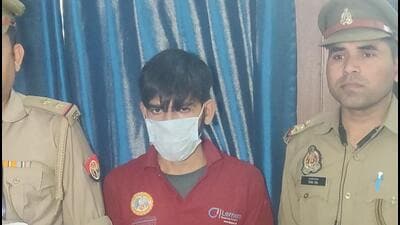 Police with the accused on Tuesday. (HT PHOTO) Police with the accused on Tuesday. (HT PHOTO)