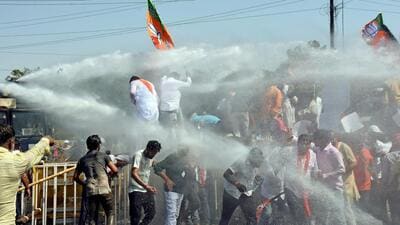 RBJP supporters brave water cannons during the protest. (ANI) RBJP supporters brave water cannons during the protest. (ANI)