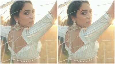 Sobhita looked stunning in the white blouse featuring stripes in shades of multiple coloured resham threads, a plunging sweetheart neckline and pearl hanging details at the borders.&nbsp; (Instagram/@sobhitad)