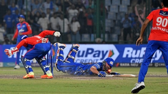 Mumbai Indians Tim David makes it to the crease to win the match against Delhi Capitals at Arun Jaitley Stadium in New Delhi(ANI)