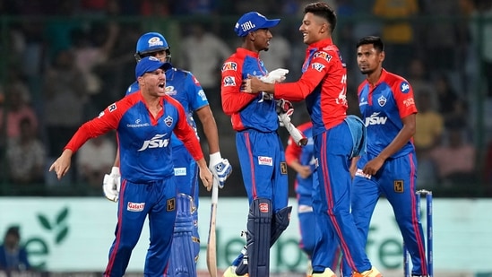 Delhi Capitals players celebrate the wicket of Rohit Sharma during IPL 2023 match at the Arun Jaitley Stadium in New Delhi(PTI)