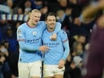 Manchester City's Erling Haaland, left, celebrates with his teammate Jack Grealish at the end of the Champions League quarterfinal, first leg, soccer match between Manchester City and Bayern Munich at the Etihad stadium in Manchester, England, Tuesday, April 11, 2023. Manchester City won 3-0. (AP Photo/Jon Super) Manchester City's Erling Haaland, left, celebrates with his teammate Jack Grealish at the end of the Champions League quarterfinal, first leg, soccer match between Manchester City and Bayern Munich at the Etihad stadium in Manchester, England, Tuesday, April 11, 2023. Manchester City won 3-0. (AP Photo/Jon Super)