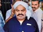 Prayagraj Police with jailed-mafia Atiq Ahmed outside Sabarmati Central Jail as he is being shifted to Prayagraj. Prayagraj Police with jailed-mafia Atiq Ahmed outside Sabarmati Central Jail as he is being shifted to Prayagraj.