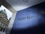 FILE PHOTO: The logo of Credit Suisse is pictured in front of the Swiss Parliament Building, in Bern, Switzerland, March 19, 2023. REUTERS/Denis Balibouse/File Photo