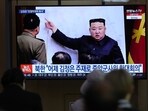A TV screen shows an image of North Korean leader Kim Jong Un.