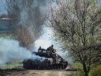 Ukrainian service members ride a tank, as Russia's attack on Ukraine continues, near the front line city of Bakhmut, Ukraine.