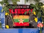 A poster which says, 'Myanmar is bleeding'. A poster which says, 'Myanmar is bleeding'.