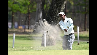 A player in action during the PGTI Golf Tournament at Chandigarh Golf Club on Wednesday. (Ravi Kumar/HT)