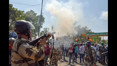A security personnel fires a tear gas shell to disperse Bharatiya Janata Party (BJP) supporters during the 'Jharkhand Sachivalaya Gherao' protest against chief minister Hemant Soren in Ranchi on Tuesday (ANI) A security personnel fires a tear gas shell to disperse Bharatiya Janata Party (BJP) supporters during the 'Jharkhand Sachivalaya Gherao' protest against chief minister Hemant Soren in Ranchi on Tuesday (ANI)