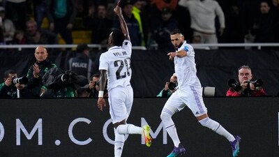 Karim Benzema, right, celebrates after scoring his side's 3rd goal with Real Madrid's Vinicius Junior (AP)