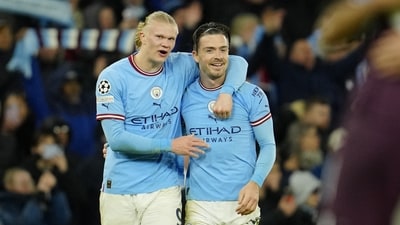 Manchester City's Erling Haaland, left, celebrates with his teammate Jack Grealish at the end of the Champions League quarterfinal, first leg, soccer match between Manchester City and Bayern Munich at the Etihad stadium in Manchester, England, Tuesday, April 11, 2023. Manchester City won 3-0. (AP Photo/Jon Super) (AP)