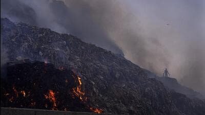 Clearing the landfill sites was one of the 10 pre-poll guarantees made by the Aam Aadmi Party in run-up to the MCD polls in December last year. The civic body, in its budget for 2023-24, had affirmed expedited deadlines to clear the landfill sites. (AP Photo) Clearing the landfill sites was one of the 10 pre-poll guarantees made by the Aam Aadmi Party in run-up to the MCD polls in December last year. The civic body, in its budget for 2023-24, had affirmed expedited deadlines to clear the landfill sites. (AP Photo)