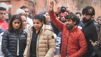 Wrestlers Vinesh Phogat, Sakshi Malik and Bajrang Punia during their 'dharna' to protest against the Wrestling Federation of India (WFI), at Jantar Mantar in New Delhi (PTI)