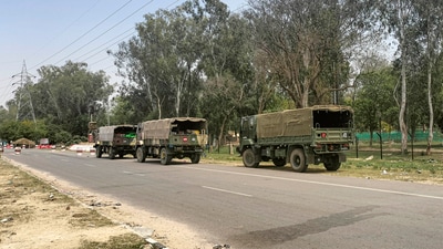 Army vehicles outside the Bathinda military station where a firing incident took place Wednesday morning, April 12, 2023. Four people were killed. (PTI Photo) Army vehicles outside the Bathinda military station where a firing incident took place Wednesday morning, April 12, 2023. Four people were killed. (PTI Photo)
