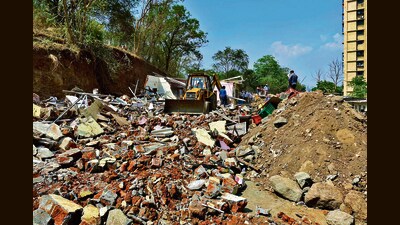 Thane, India - April 12, 2023: In a major crackdown on illegal construction on Collector's land , the Thane Collector, Tehsildar and Thane Municipal Corporation (TMC) jointly initiated the demolition of 40 illegal constructions at Kasarvadavali, in Thane, India, on Wednesday, April 12, 2023. (Praful Gangurde/HT Photo) (HT PHOTO)