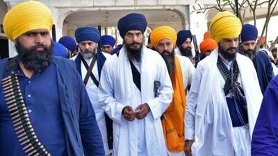 Waris Punjab De chief Amritpal Singh, who is absconding since March 18, with supporters. The radical Sikh preacher, against whom the National Security Act (NSA) has been invoked, remains at large since his escape from the Mehatpur market in Jalandhar. (File photo) Waris Punjab De chief Amritpal Singh, who is absconding since March 18, with supporters. The radical Sikh preacher, against whom the National Security Act (NSA) has been invoked, remains at large since his escape from the Mehatpur market in Jalandhar. (File photo)
