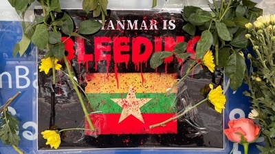 A poster which says, 'Myanmar is bleeding'. (Reuters) A poster which says, 'Myanmar is bleeding'. (Reuters)