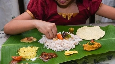 Celebrations: On Vishu day, people wake up early and view the Vishukkani, which is arranged in the puja room or in a special place in the house. They also offer prayers and perform rituals, wear new clothes, and exchange gifts. Traditional dishes like "Vishu Kanji" (rice porridge) and "Vishu Katta" (rice cake) are prepared and shared with family and friends. (File Photo (Shutterstock)) Celebrations: On Vishu day, people wake up early and view the Vishukkani, which is arranged in the puja room or in a special place in the house. They also offer prayers and perform rituals, wear new clothes, and exchange gifts. Traditional dishes like "Vishu Kanji" (rice porridge) and "Vishu Katta" (rice cake) are prepared and shared with family and friends. (File Photo (Shutterstock))
