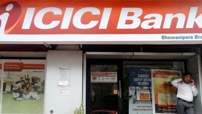 A man speaks on the phone outside an ICICI Bank branch in Kolkata, India. (REUTERS/Used only for representation) A man speaks on the phone outside an ICICI Bank branch in Kolkata, India. (REUTERS/Used only for representation)