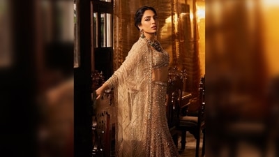 Sobhita Dhulipala's lehenga features a delicate net, bejewelled with sprays of sequins and exquisite mirror work, along with a mix of crystals and gold zari.&nbsp; (Instagram/@sobhitad)