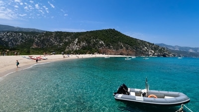 Cala Macarella, Menorca: This hidden beach on the Balearic Island of Menorca is a true gem. With crystal-clear turquoise waters and white sand, it’s the perfect place to escape and relax. (Unsplash)