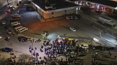 People take part in a vigil for the victims of a fire at an immigration detention center that killed dozens, outside the detention center in Ciudad Juarez, Mexico, March 28, 2023. (AP) People take part in a vigil for the victims of a fire at an immigration detention center that killed dozens, outside the detention center in Ciudad Juarez, Mexico, March 28, 2023. (AP)
