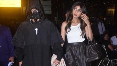 Shilpa Shetty and husband Raj Kundra were seen arriving at the Mumbai airport. Was Raj was in an all black look and wore a stylish mask as well, Shilpa was in a white top and black skirt. (Varinder Chawla) Shilpa Shetty and husband Raj Kundra were seen arriving at the Mumbai airport. Was Raj was in an all black look and wore a stylish mask as well, Shilpa was in a white top and black skirt. (Varinder Chawla)