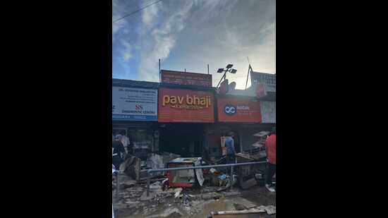 The fire, suspected to have erupted due to a short-circuit, engulfed the eatery, Pav Bhaji Express, within minutes, causing loss worth over ₹2 lakh. (HT Photo)