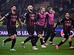 AC Milan's French forward Olivier Giroud (L), AC Milan's French defender Theo Hernandez (2ndL), AC Milan's Spanish midfielder Brahim Diaz (R) and teammates acknowledge the public at the end of the UEFA Champions League quarter-finals first leg football match between AC Milan and SSC Napoli on April 12, 2023 at the San Siro stadium in Milan. (Photo by Marco BERTORELLO / AFP)