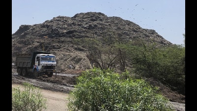 A MCG truck dump the garbage at Bandhwari waste treatment plant located at Gurugram-Faridabad road near Toll Plaza. (HT File) A MCG truck dump the garbage at Bandhwari waste treatment plant located at Gurugram-Faridabad road near Toll Plaza. (HT File)