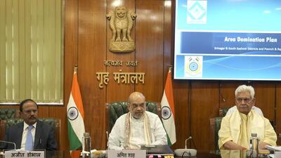 Union minister Amit Shah flanked by NSA Ajit Doval and J&K Lieutenant Governor Manoj Sinha during a meeting, in Delhi. (PTI) Union minister Amit Shah flanked by NSA Ajit Doval and J&K Lieutenant Governor Manoj Sinha during a meeting, in Delhi. (PTI)