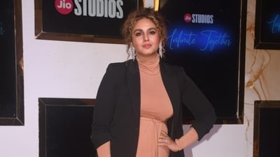 Huma Qureshi sported coloured hair as she arrived in a beige dress paired with a long blazer at the event. She will next be see as late chef Tarla Dalal in her biopic and in Pooja Meri Jaan. (Varinder Chawla) Huma Qureshi sported coloured hair as she arrived in a beige dress paired with a long blazer at the event. She will next be see as late chef Tarla Dalal in her biopic and in Pooja Meri Jaan. (Varinder Chawla)
