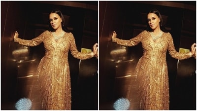 Neha’s gown came with sequined details and golden embellishments throughout. Featuring a plunging neckline, the golden gown had full sleeves and a cascading golden skirt. (Instagram/@nehadhupia) Neha’s gown came with sequined details and golden embellishments throughout. Featuring a plunging neckline, the golden gown had full sleeves and a cascading golden skirt. (Instagram/@nehadhupia)