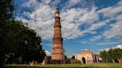 Qutub Minar: Another iconic monument in Delhi is the Qutub Minar. It is the tallest brick minaret in the world, standing at a height of 73 meters. The tower was built in the 12th century by Qutb-ud-din Aibak and is surrounded by several other historical structures, including the Iron Pillar and the Quwwat-ul-Islam Mosque. (Unsplash) Qutub Minar: Another iconic monument in Delhi is the Qutub Minar. It is the tallest brick minaret in the world, standing at a height of 73 meters. The tower was built in the 12th century by Qutb-ud-din Aibak and is surrounded by several other historical structures, including the Iron Pillar and the Quwwat-ul-Islam Mosque. (Unsplash)