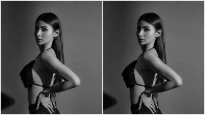 Mouni raised the oomph quotient on Instagram with the set of monochrome pictures of herself posing like a diva and showing off her toned abs. (Instagram/@imouniroy) Mouni raised the oomph quotient on Instagram with the set of monochrome pictures of herself posing like a diva and showing off her toned abs. (Instagram/@imouniroy)