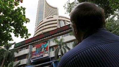 A man looks at a screen across a road displaying the Sensex on the facade of the Bombay Stock Exchange (BSE) building in Mumbai, India. (File image) (REUTERS)
