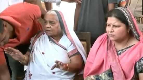 Shanti Devi, mother of Umesh Pal along with her daughter-in-law and Pal's wife Jaya Devi. (ANI)