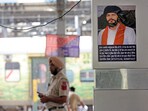 'Waris Punjab De' Chief Amritpal Singh's poster put up by Punjab Police at the Amritsar Railway Station, stating that a suitable reward would be given to anyone who tells about his whereabouts and his name would be kept confidential, in Amritsar on Thursday. 