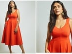 Mrunal Thakur proves less is more with her hot girl summer look in a tangerine sleeveless dress.&nbsp;