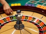 The spinning wheel on a roulette table is seen at Japan Casino School in Tokyo. Japan approves controversial plan to open first casino in Osaka to lure tourists 