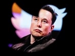 Elon Musk's photo is seen through a Twitter logo in this illustration.