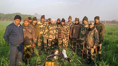 BSF personnel after shooting down a Pakistani drone entering India from along the International Border in Punjab on Feb 3. (PTI) BSF personnel after shooting down a Pakistani drone entering India from along the International Border in Punjab on Feb 3. (PTI)