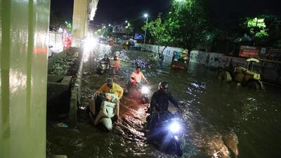 Commuters wade through waterlogged street at Katraj on Thursday. (HT PHOTO) Commuters wade through waterlogged street at Katraj on Thursday. (HT PHOTO)