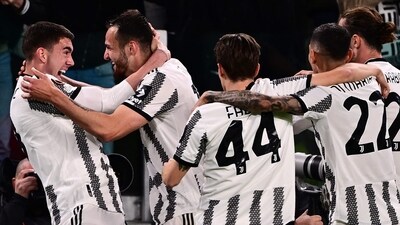 Juventus' Italian defender Federico Gatti (2ndL) celebrates with Juventus' Serbian forward Dusan Vlahovic (L) after opening the scoring during the UEFA Europa League quarter-finals first leg football match between Juventus and Sporting CP, on April 13, 2023 at the Juventus stadium in Turin. (Photo by Marco BERTORELLO / AFP) (AFP) Juventus' Italian defender Federico Gatti (2ndL) celebrates with Juventus' Serbian forward Dusan Vlahovic (L) after opening the scoring during the UEFA Europa League quarter-finals first leg football match between Juventus and Sporting CP, on April 13, 2023 at the Juventus stadium in Turin. (Photo by Marco BERTORELLO / AFP) (AFP)